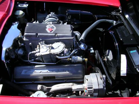 1996 Ford Probe - Close-up view of a V8 engine, showing the carburetor and alternator.