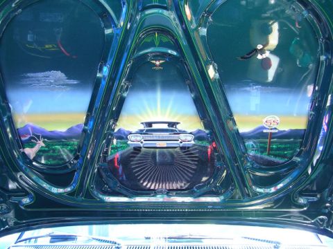 1996 Ford Probe - The interior of a car hood is painted with a scenic landscape, a classic car and an SS sign.