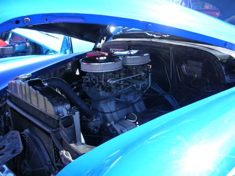 1996 Ford Probe - Close-up view of a car's engine bay, highlighting the dual carburetors and chrome air filters.