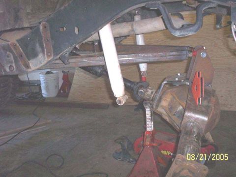 1994 Ford Bronco - The photo shows a vehicle's rear axle and suspension system, likely undergoing modifications or repairs.