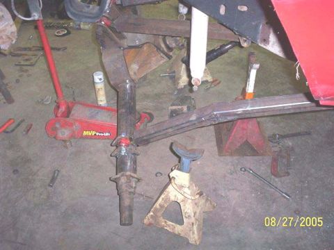 1994 Ford Bronco - Suspension components and tools are visible around the frame of a red vehicle. The image is dated 08/27/2005.