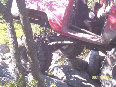 1994 Ford Bronco - This off-road vehicle is shown traversing a difficult rocky landscape.