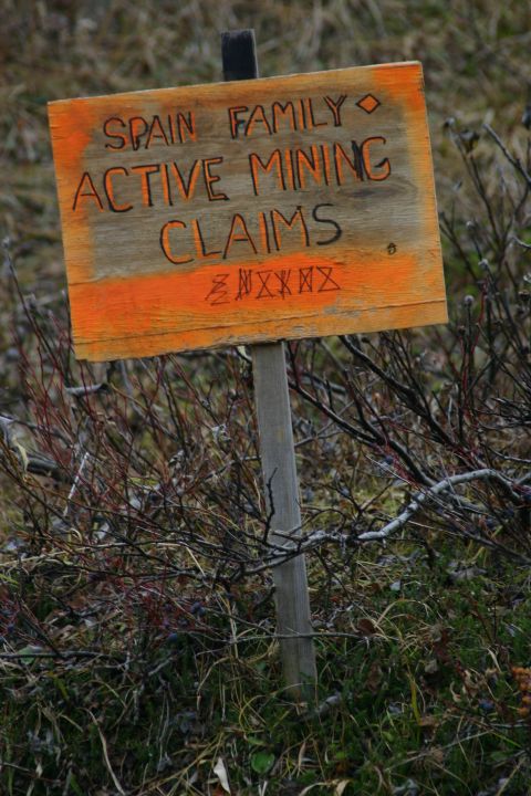 2003 Jeep TJ - A wooden sign with orange trim indicates active mining claims for the Spain family.