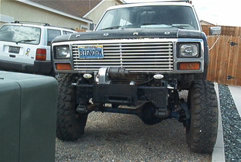 1986 Ford Bronco - This 1986 Ford Bronco features a prominent winch mounted on its front bumper.