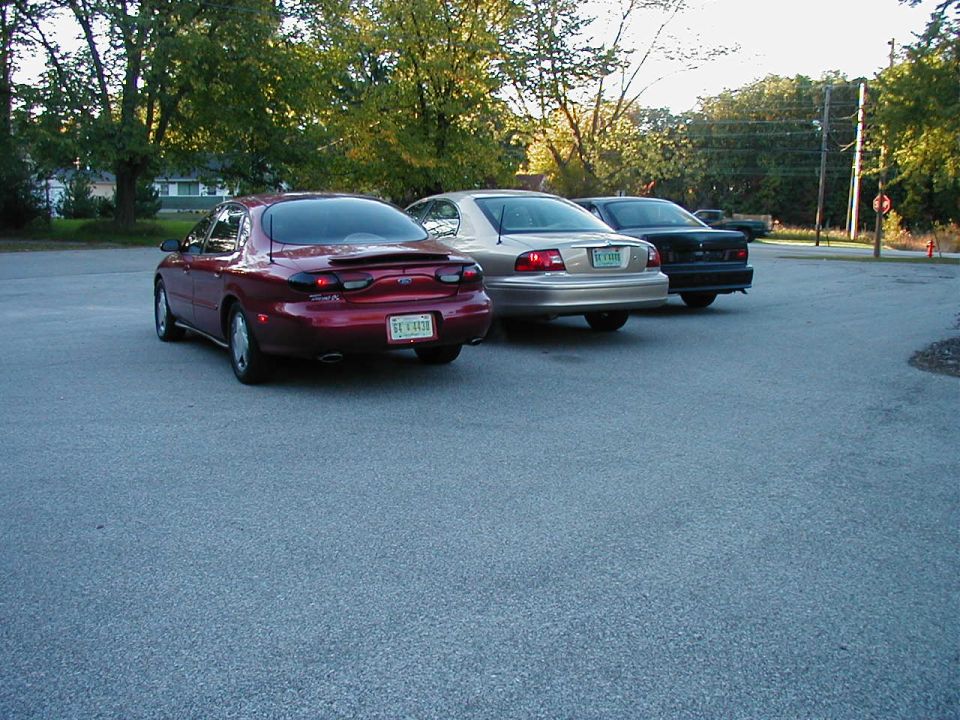 Red sedan from rear, 1996 model year