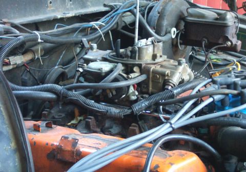 1978 Ford Bronco - Close-up view of a vehicle's engine bay, showing various components and wiring.