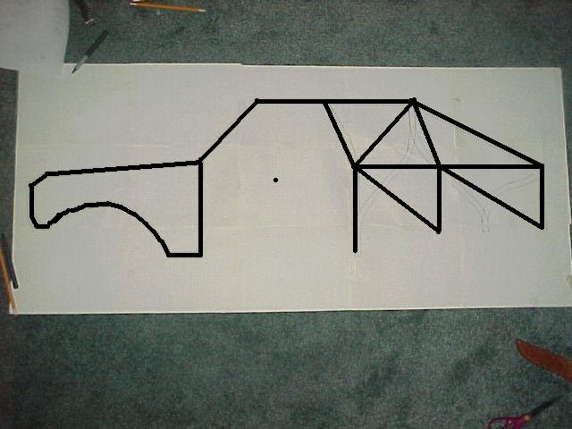 Hand-drawn roll cage and body profile tubing layout sketch on paper