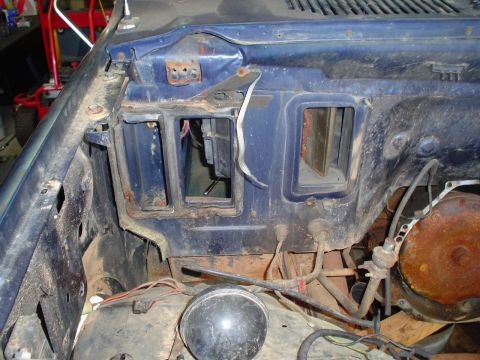 1984 Ford Bronco - The interior firewall area shows vents and exposed wiring, indicating a part of the vehicle's internal systems.