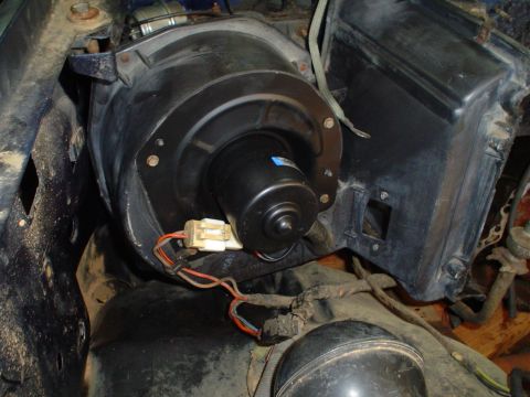 1984 Ford Bronco - The HVAC blower motor assembly is visible, with its wiring harness connected.