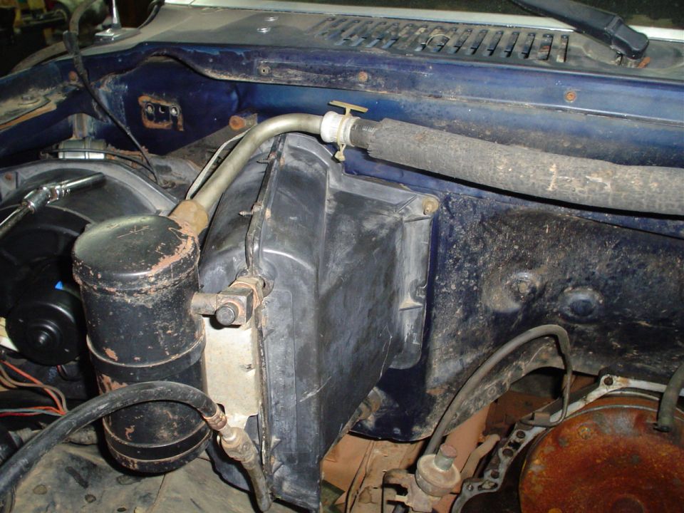 Vehicle's AC receiver-drier and heater core housing under the dash