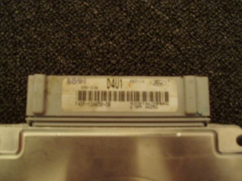 1993 Ford Taurus - Close-up of a Ford electronic control unit, part number visible on label.