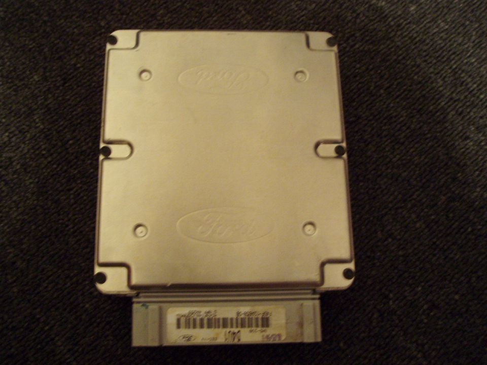 Ford engine control module with two embossed Ford logos and a label with a barcode