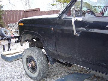 1986 Ford F-150 - Side view of a 1986 Ford F-150 showing the front fender and door panel.