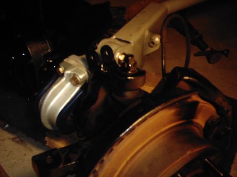 1978 Ford Bronco - Vehicle suspension components are visible in this close-up shot, with a brake rotor in the foreground.