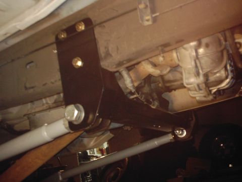 1978 Ford Bronco - Close-up view of the undercarriage, showing suspension parts and drivetrain.