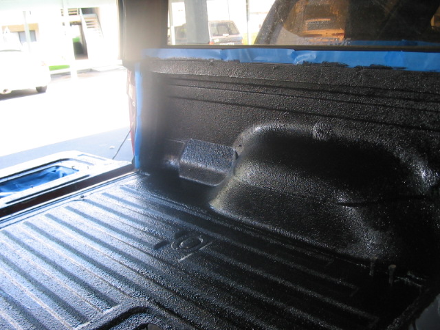 Black spray-on truck bed liner with ribbed floor