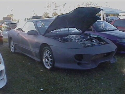 1994 Ford Probe - This 1994 Ford Probe is displayed with its hood open, revealing the engine compartment.