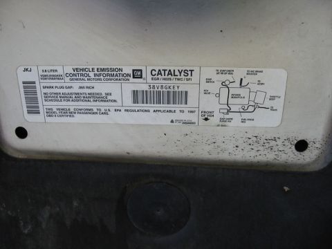 1997 Pontiac Grand Prix - A vehicle emission control information label, applicable to 1997 model-year new passenger cars, is shown.