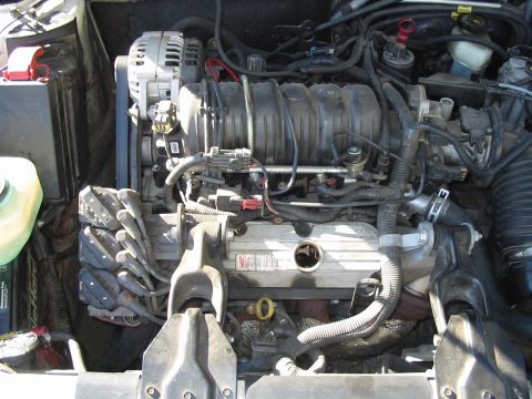 1997 Pontiac Grand Prix - Engine bay view showing various components including the alternator and intake manifold.