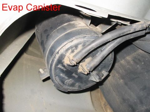 1997 Pontiac Grand Prix - Close-up of a vehicle's evap canister, showing its connection points and labels.