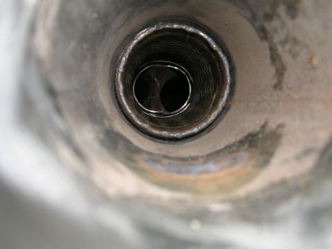 1996 Ford Probe - View inside an exhaust pipe, revealing its internal structure and baffles.