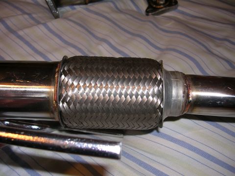 1996 Ford Probe - This is a close-up view of a flexible exhaust pipe, likely a replacement part for a vehicle.