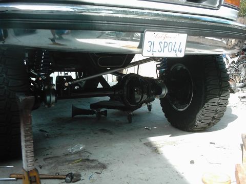 1978 Ford Bronco - Custom rear axle and suspension work on a lifted truck, with a California license plate.