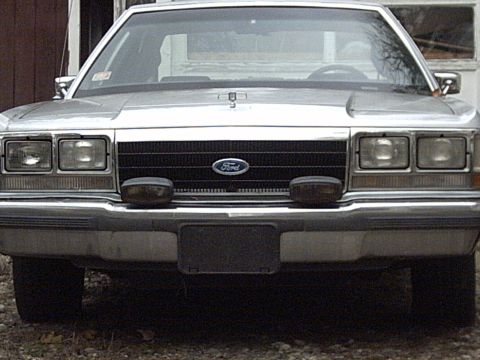 1991 Ford Crown Victoria LTD - This Ford Crown Victoria has a distinctive grille and headlight design.
