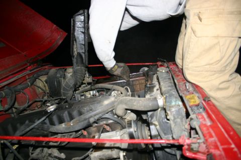 2003 Jeep TJ - Working on the engine of a 2003 Jeep TJ, removing the radiator.