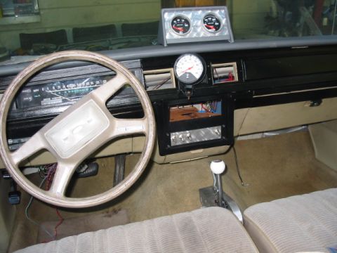 1985 Ford LTD Crown Victoria - Interior view of a 1985 Ford Crown Victoria LTD, aftermarket gauges and a modified center console.