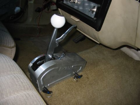 1985 Ford LTD Crown Victoria - Close-up of an aftermarket automatic shifter with a white ball knob and chrome lever.