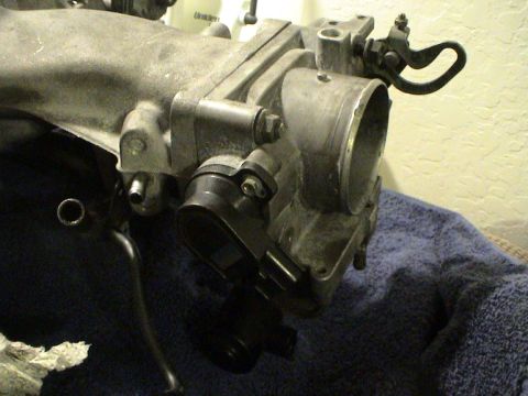 1997 Ford Probe - Throttle body assembly, likely from an engine, shown in detail.