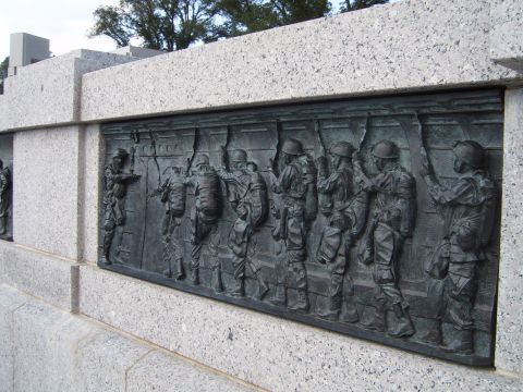 1988 Ford Bronco - Bronze relief sculpture of soldiers on a granite monument.