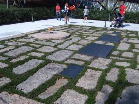 1988 Ford Bronco - The eternal flame at Arlington National Cemetery is seen with visitors and gravestones in the background.