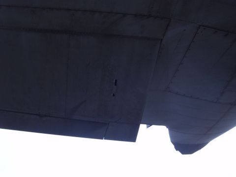 1988 Ford Bronco - The underside of an aircraft wing is shown, revealing panel lines and rivets.