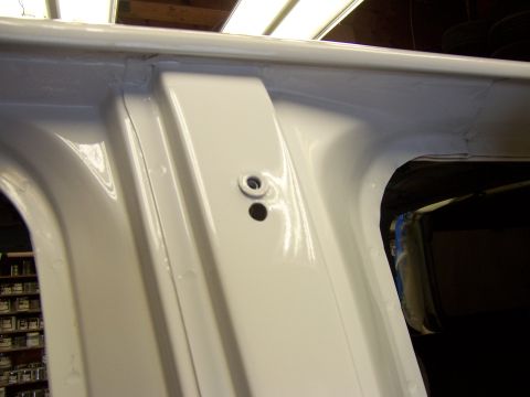 1993 Ford C-350 (Centurion Conversions) - The interior of a vehicle's door frame shows fresh white paint and structural details.