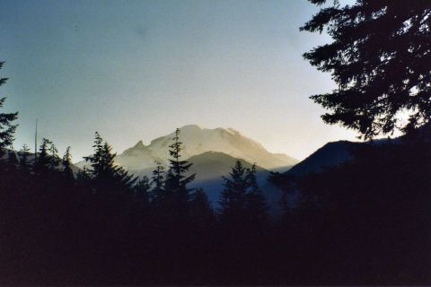2001 Ford Taurus - A scenic view of mountains and trees as the sun sets, with a watermark at the bottom right.