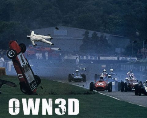 1995 Ford Bronco - A race car is airborne and upside down after an accident, with its driver ejected.