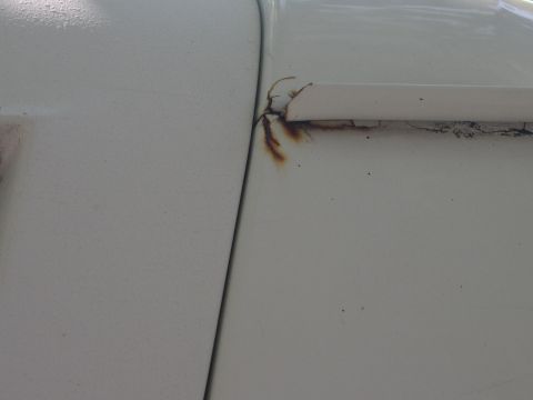 1992 Ford Bronco - rust spot same on both sides up by drip rail above door