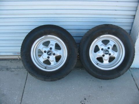 1997 Ford Crown Victoria - A pair of aftermarket wheels and tires are displayed against a neutral background.