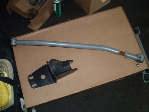 1994 Ford Bronco - Automotive suspension components are laid out on a large cardboard box.