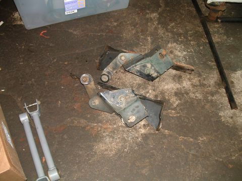 1994 Ford Bronco - Vehicle suspension components are laid out on a workshop floor.