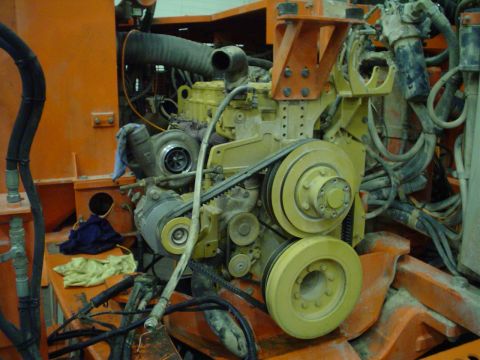 1966 International School Bus - Close-up view of an engine with a turbocharger and drive belts.
