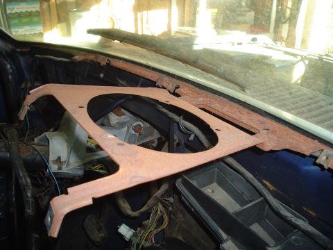 1984 Ford Bronco - The dashboard interior shows a rusty bracket and wiring, suggesting a vehicle from the early 1980s.
