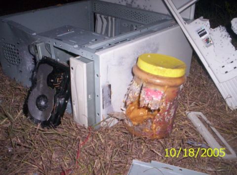 1995 Ford Bronco - The jar...also the HDD on the left....don't know HOW that CD drive in the case is still in tact...didn't even get scratched!