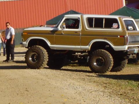 1979 Ford Bronco - Side view of a modified 1978 Ford Bronco with custom suspension and tires.