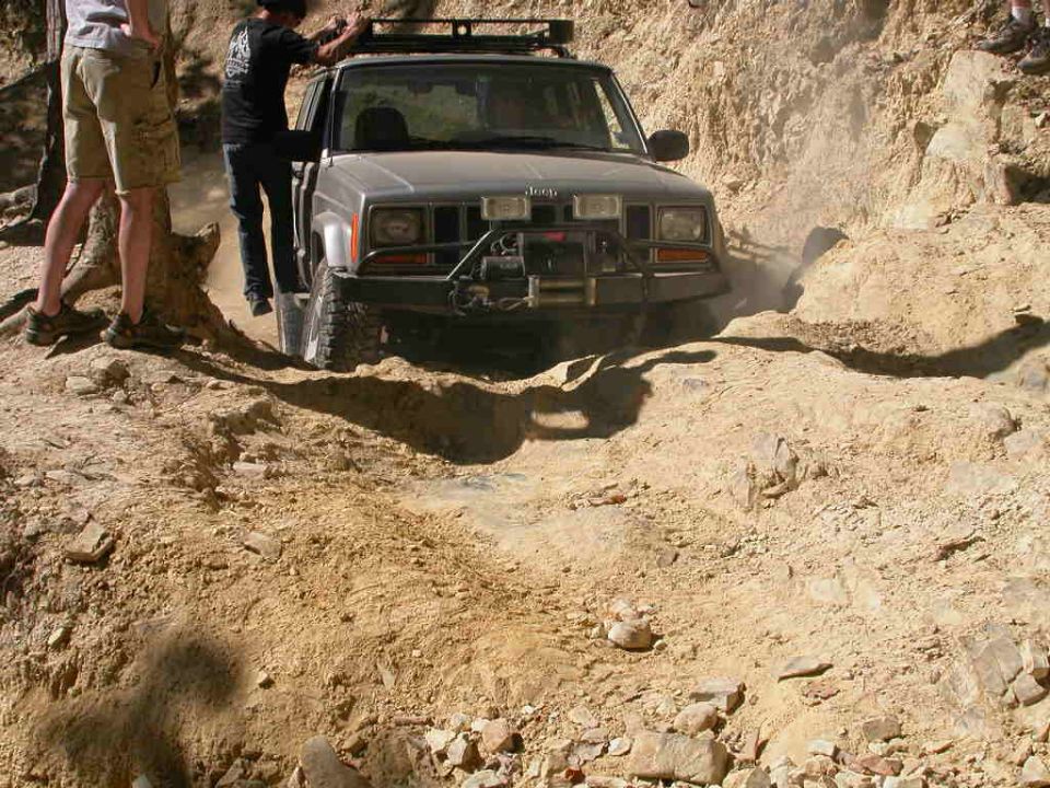 This Cherokee was entirely too nice to be out here, it didn't have a ding on it anywhere I could see.  You can see in this pic that he needed some extra weight on the passenger side to get the traction to get over that ledge.
