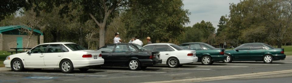 1991 Ford Taurus and other sedans parked side-by-side