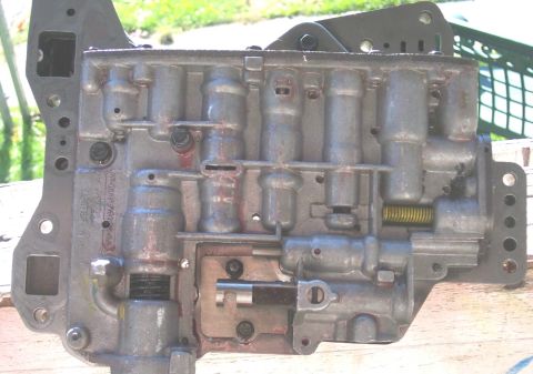 1978 Ford Bronco - This automatic transmission valve body shows intricate internal components and metal construction.