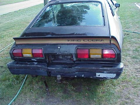 1978 Ford Mustang II - The rear of a 1978 Ford Mustang II King Cobra is shown, its distinctive taillights and spoiler.
